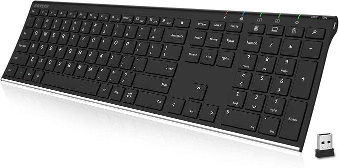 Arteck full-size wireless keyboard in black with a slim silver-edged frame, shown at a three-quarter angle. Includes numeric keypad and a small USB wireless receiver placed beside it.
Click to see full view
Alexa AI Ask Alexa

How long does the battery last?
 
What's the wireless range?

SponsoredWhy choose Arteck keyboards?
 
Is it easy to set up?
 
Why you might like this
 
Ask something else
Arteck 2.4G USB Wireless Keyboard Full Size Keyboard for Computer/PC/Laptop